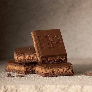 Hu Kitchen Milk Chocolate Cashew Butter bar 2.1 oz stack