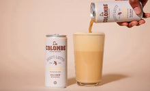 Load image into Gallery viewer, La Colombe Oat Milk Vanilla Draft Latte Lifestyle