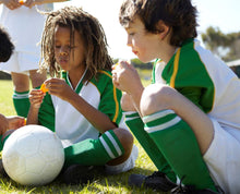 Load image into Gallery viewer, Child Athletes snacking on Jones Bar Organic Peanut Butter