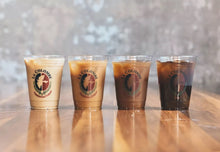 Load image into Gallery viewer, 4 cups of La Colombe Cold Brew Brazilian varying cream colors
