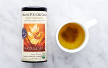 Load image into Gallery viewer, Republic of Tea Organic Turmeric Ginger Green Tea in cup