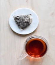 Load image into Gallery viewer, La Colombe Yunnan Breakfast Tea steeped cup